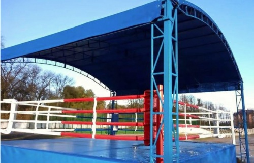 Outdoor boxing ring with canopy